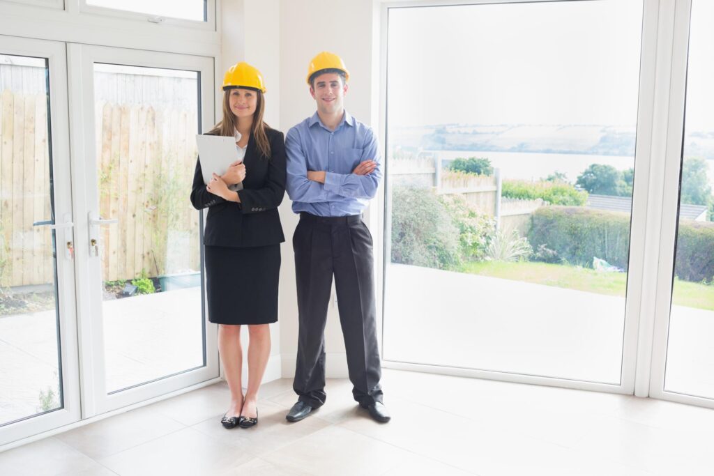 man and a lady standing near the window