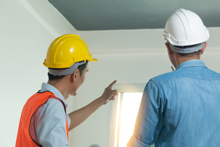 man pointing out the window