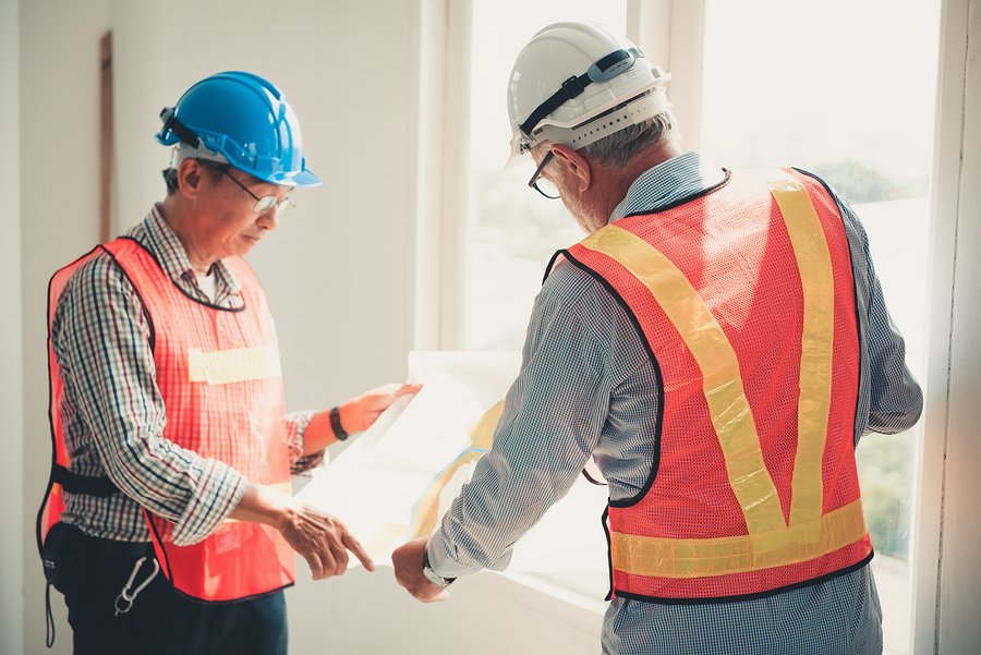 men discussing the construction plan